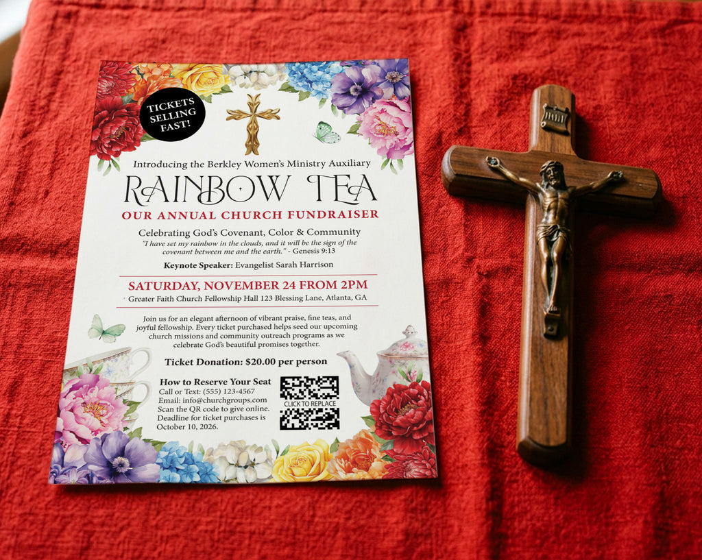 a red table cloth with an A4 rainbow tea advertising flyer laying on it next to a wooden crucifix
