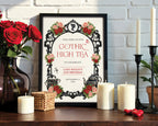 8 x 10 gothic high tea welcome sign with black ornate frame and regency cameo in a black frame leaning up against a white brick wall next to red roses and candles