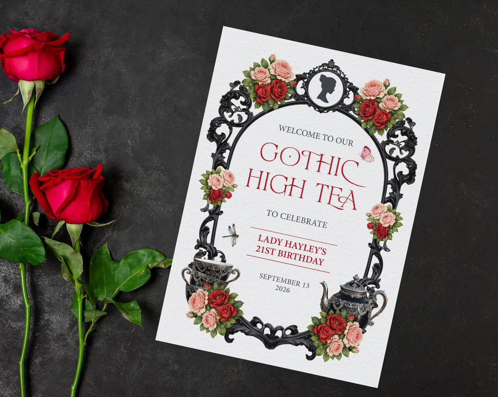 A4 red black and pink gothic high tea welcome sign laying on a black background next to some red rose stems