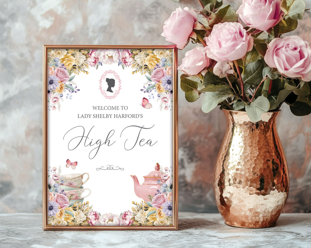 Decorative sign for a high tea event with floral design and a copper vase with pink roses.