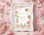an ornate white frame with a fairy garden tea party welcome sign with girl fairies, toadstool house, frog and snail graphics leaning up agains a pink flowery wall with tea cups and fairy wand in the foreground
