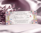 elegant pastel flower voucher for an afternoon tea with butterflies and text, leaning up against some dried flowers on a silk pink cloth