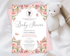 an elegant pastel baby shower tea regency style invitation laying on the pink pattern back of the invite, on a white cloth with a white teddy bear and a wrapped gift