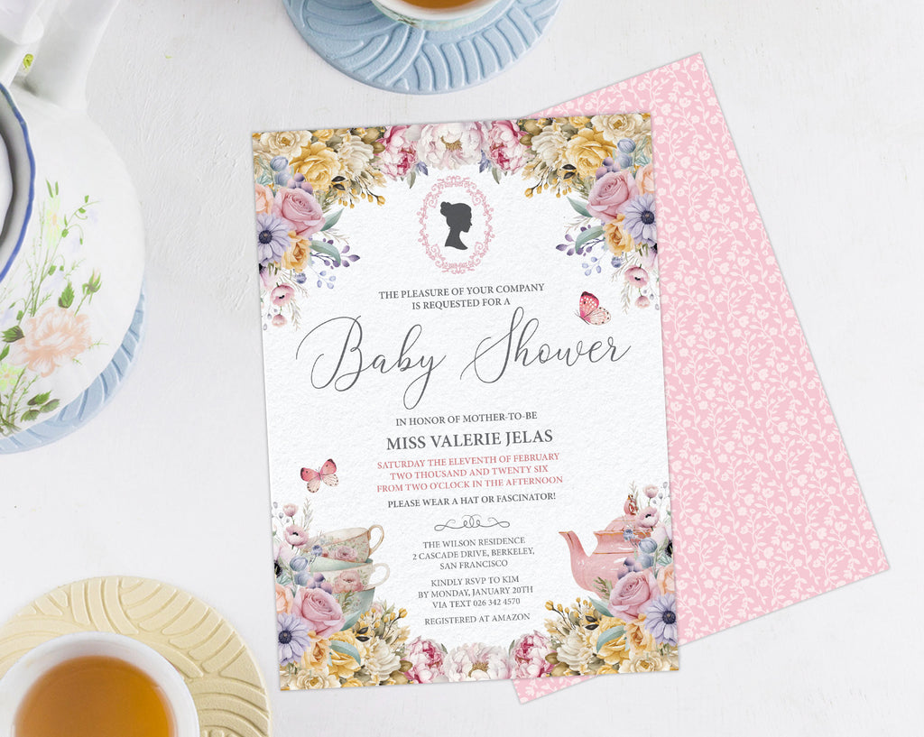 a pastel flower baby shower invitation showing the front and the pink pattern back, laying on a white background next to a pastel tea service