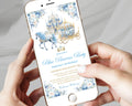 A person holds a smartphone showing a printed invitation design for a 'Blue Princess Party' with a watercolor-style castle, horse-drawn carriage, and floral border. The phone is rose gold, and the hands are visible against a soft light gray fabric background.