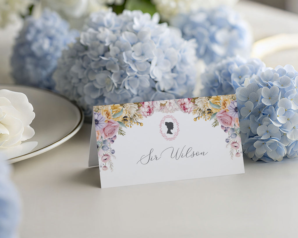 Regency style pastel name card with blue hydrangeas on a table