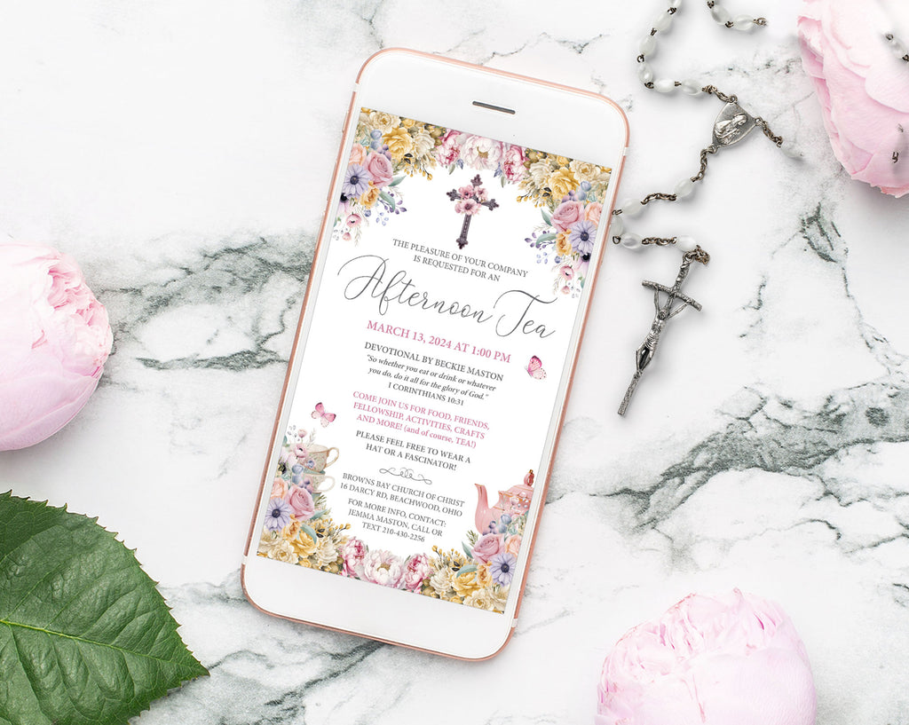 mobile Phone displaying a floral church afternoon tea invitation on a marble surface with rosary, flowers and leaves.