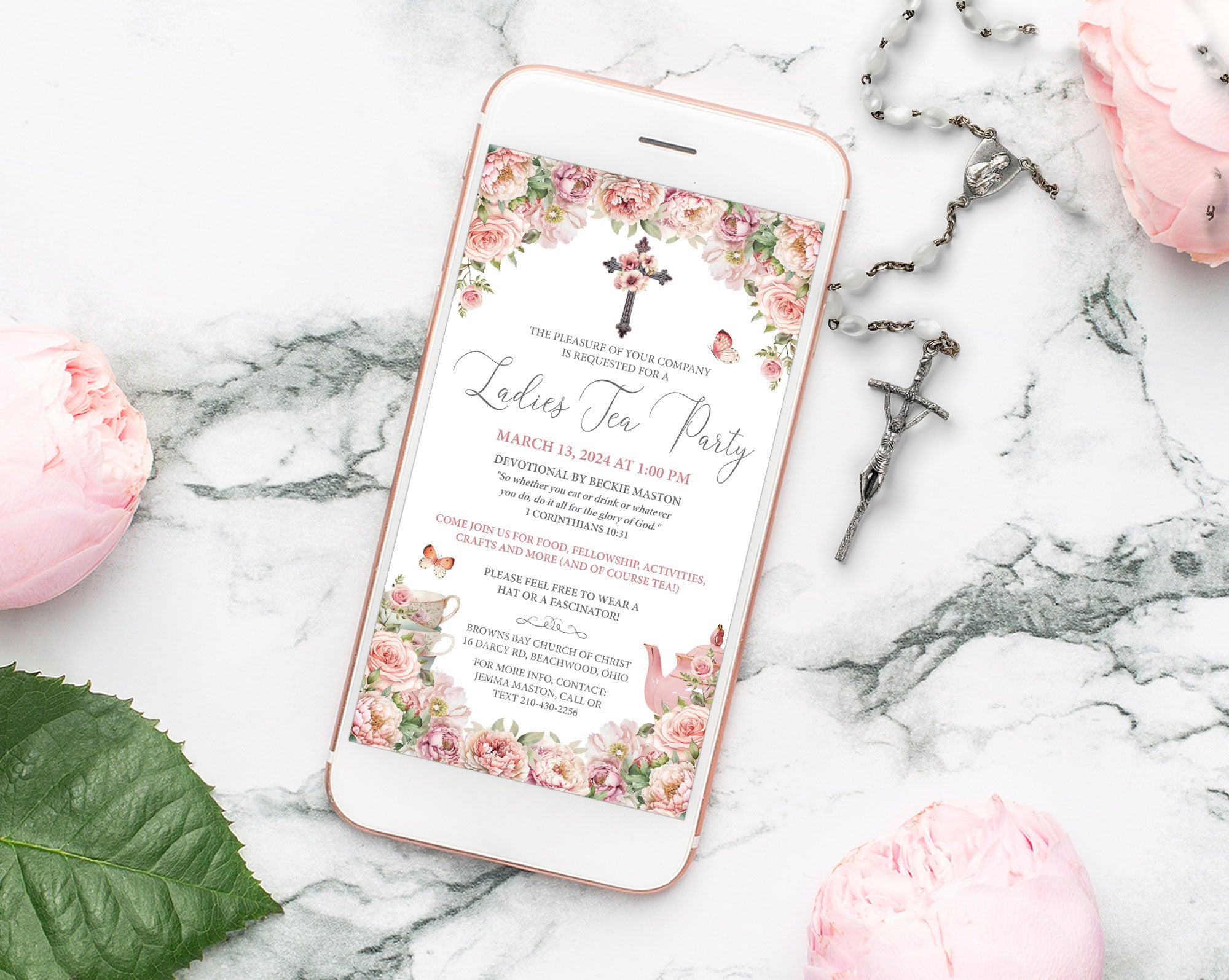 blush pink church event ladies tea invitation showing on a white mobile phone laying on a marble background next to a rosary and pink flowers