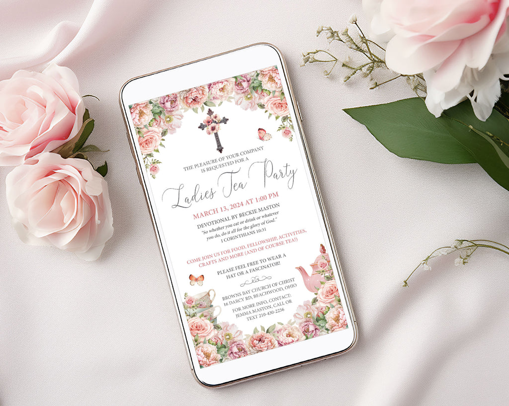 pretty blush pink church ladies afternoon tea invitation on a mobile screen laying on a white cloth next to pink flowers