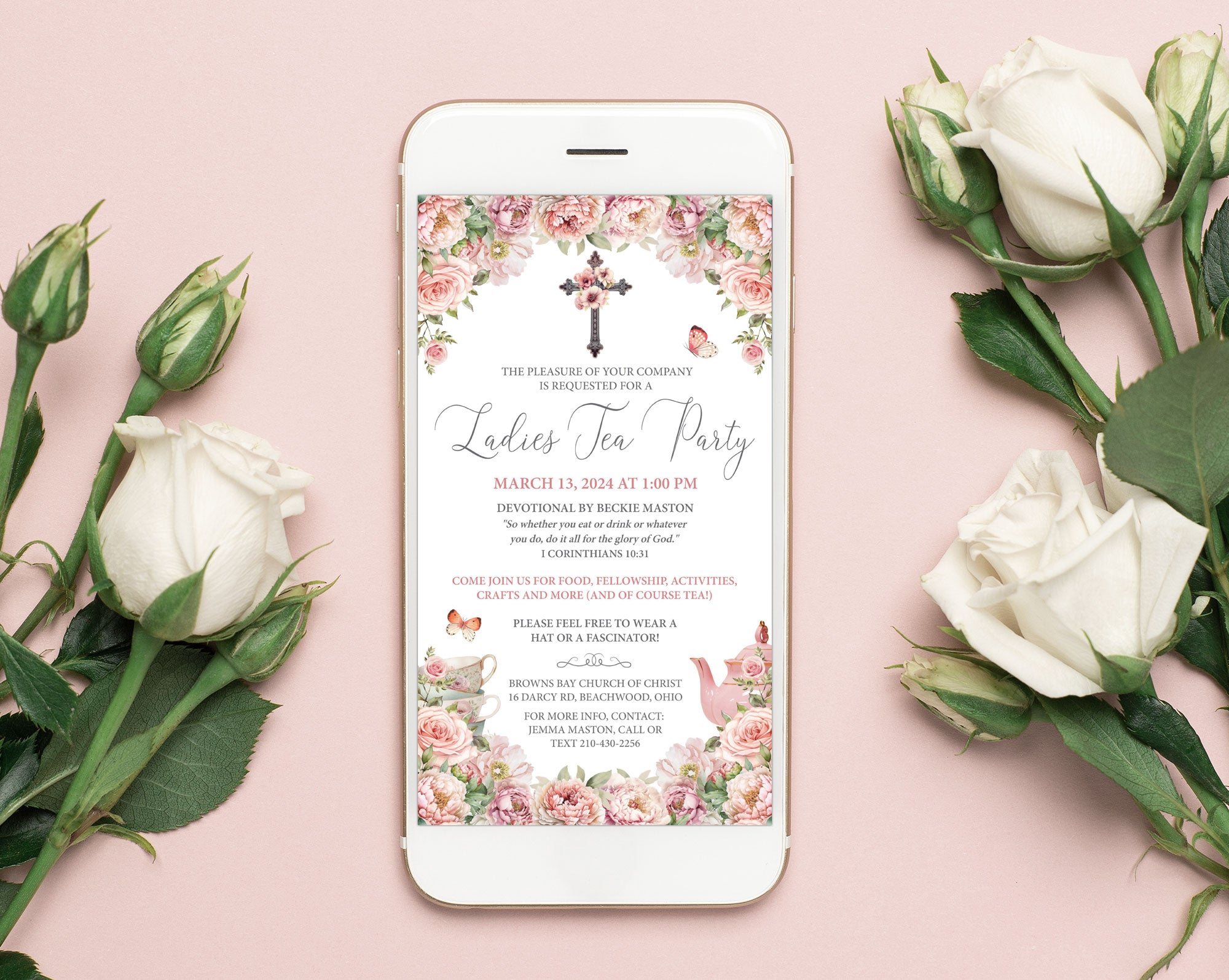 elegant church event invitation with blush pink flowers and christian crosse graphics showing on a white mobile phone laying on a pink background with white roses