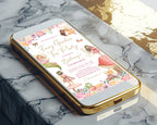a gold mobile phone laying on a marble surface with a fairy tea party invitation showing on the screen