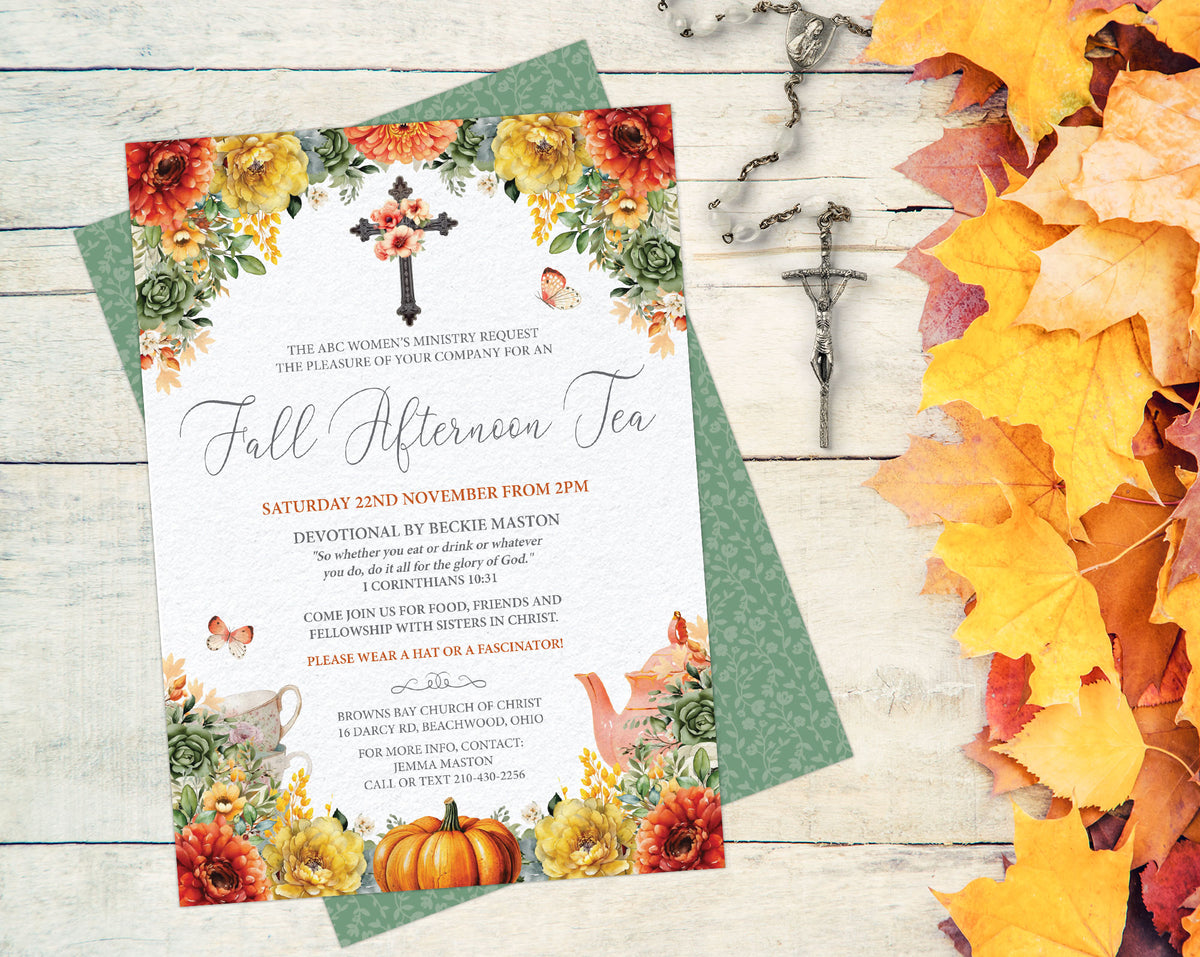 A fall-themed invitation card for a women's church tea party, styled flat-lay on a white wood background with autumn leaves and a cross. The invitation features colorful fall flowers, pumpkins, a cross, and elegant script text.