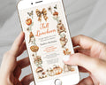 A person holding a white smartphone that displays a fall-themed birthday invitation design with autumn illustrations, including pumpkins, leaves, a plaid bow, and a bird.