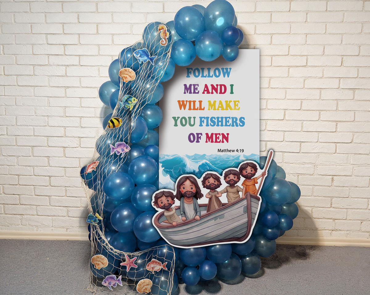 A decorative Noah's Ark themed party backdrop featuring a large white sign with the biblical quote 'FOLLOW ME AND I WILL MAKE YOU FISHERS OF MEN' and cartoon illustrations of Jesus and the children in a boat, surrounded by blue balloons, fishing net, and sea life decorations against a white brick wall.