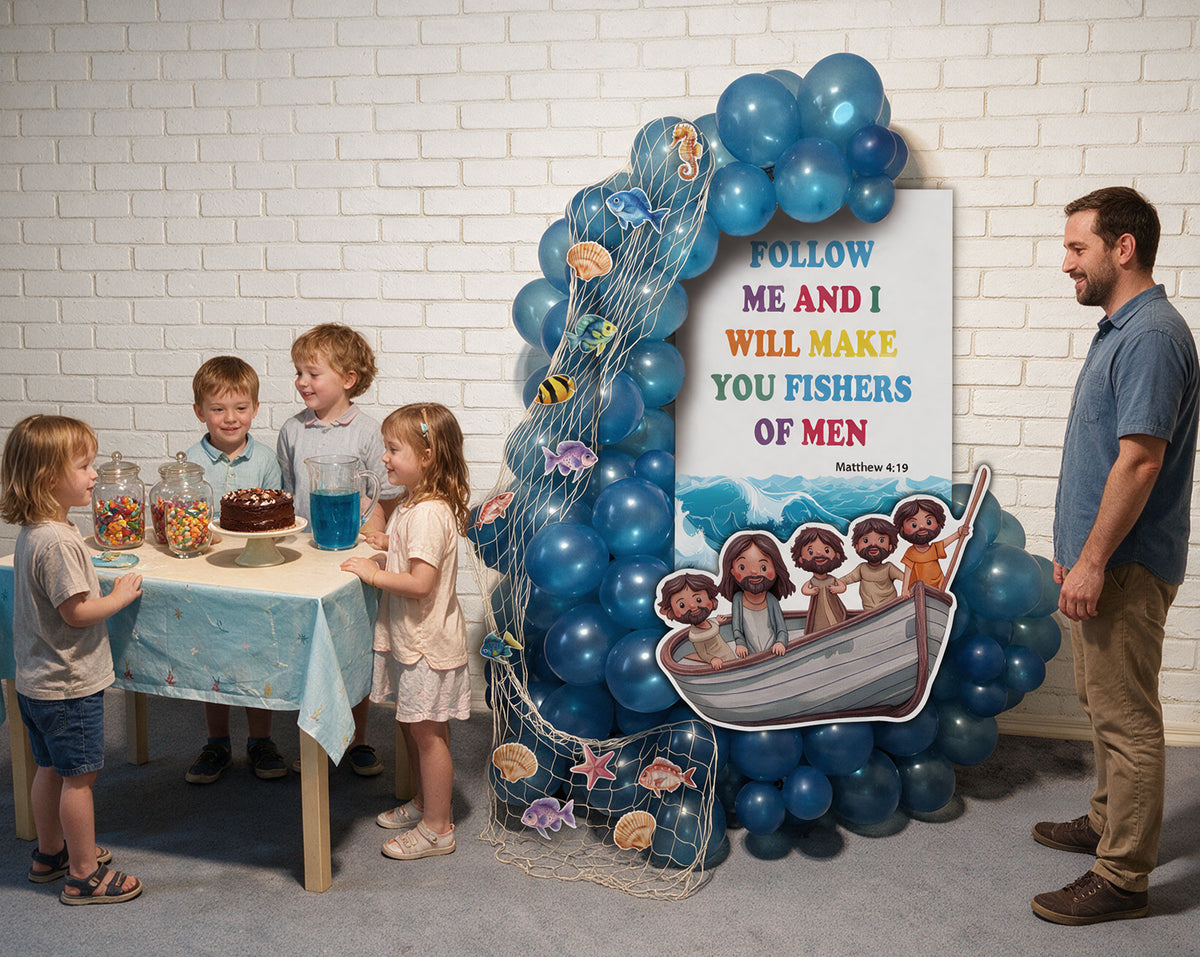 A children's party setup in a room with a white brick wall, featuring a large blue balloon arch decorated with fishing net, sea creatures, and a 'Follow Me and I Will Make You Fishers of Men' sign. Four children are gathered around a small table with a cake and drink, and a man in a blue shirt stands to the right.