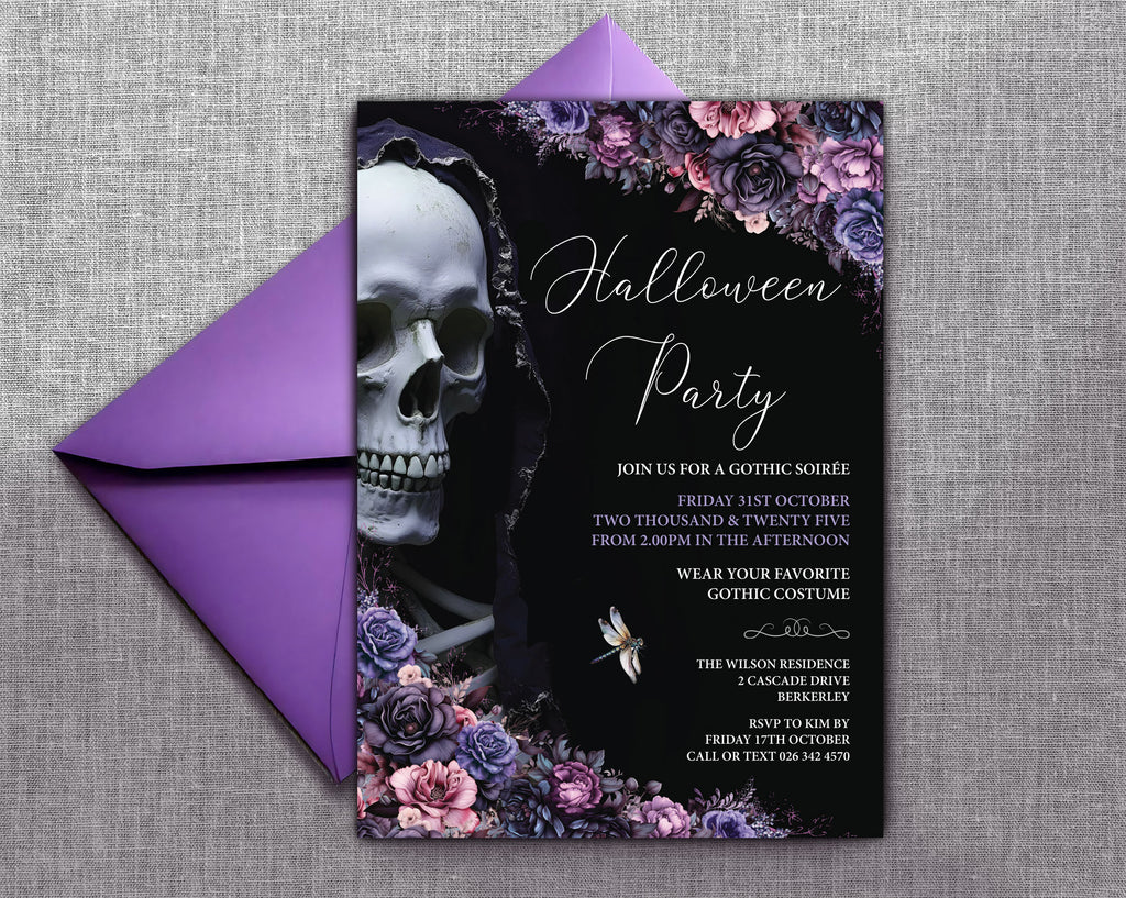 A gothic Halloween party invitation card with a black background, white script text, a large skull illustration, and purple floral accents, shown with a matching purple envelope on a gray textured fabric background.