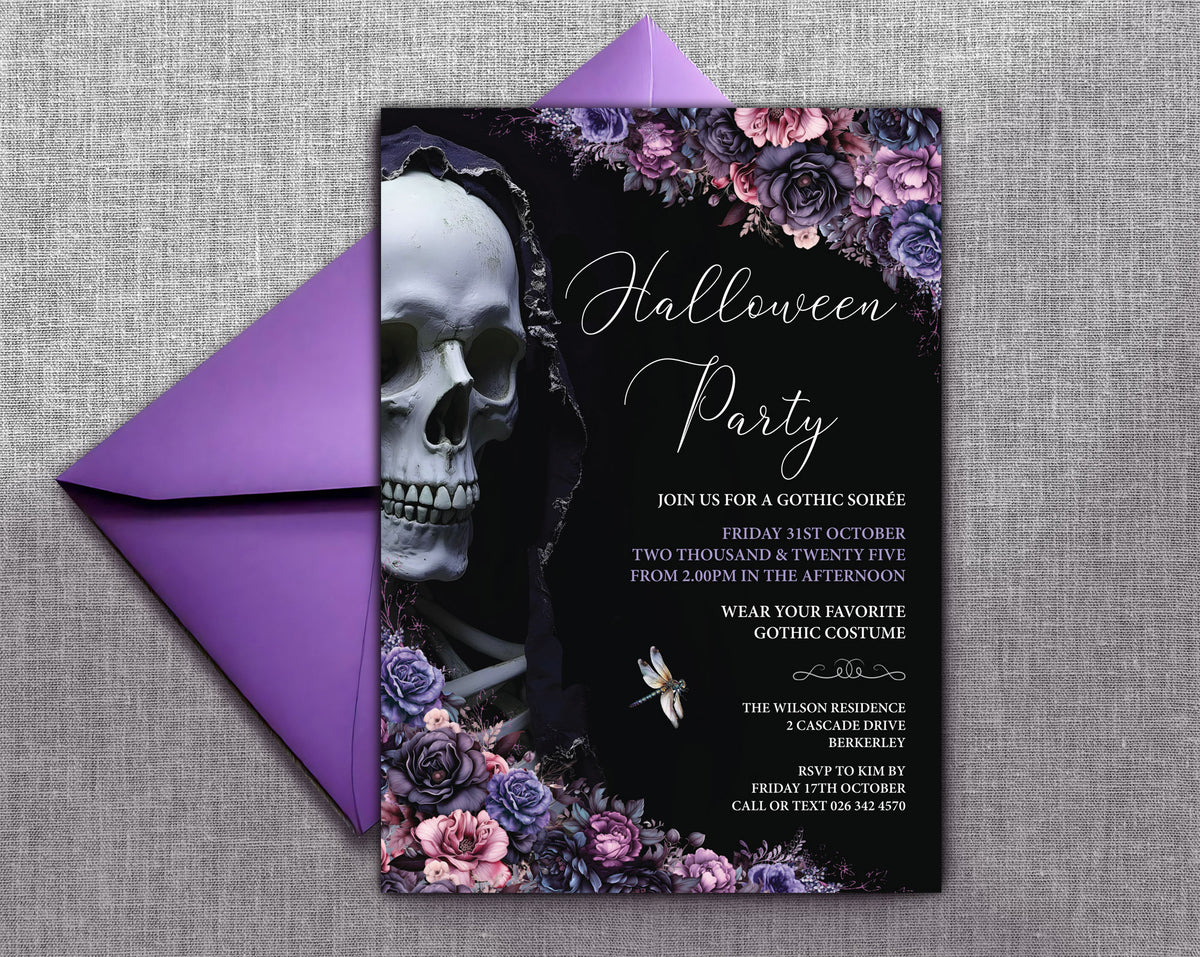 A gothic Halloween party invitation card with a black background, white script text, a large skull illustration, and purple floral accents, shown with a matching purple envelope on a gray textured fabric background.