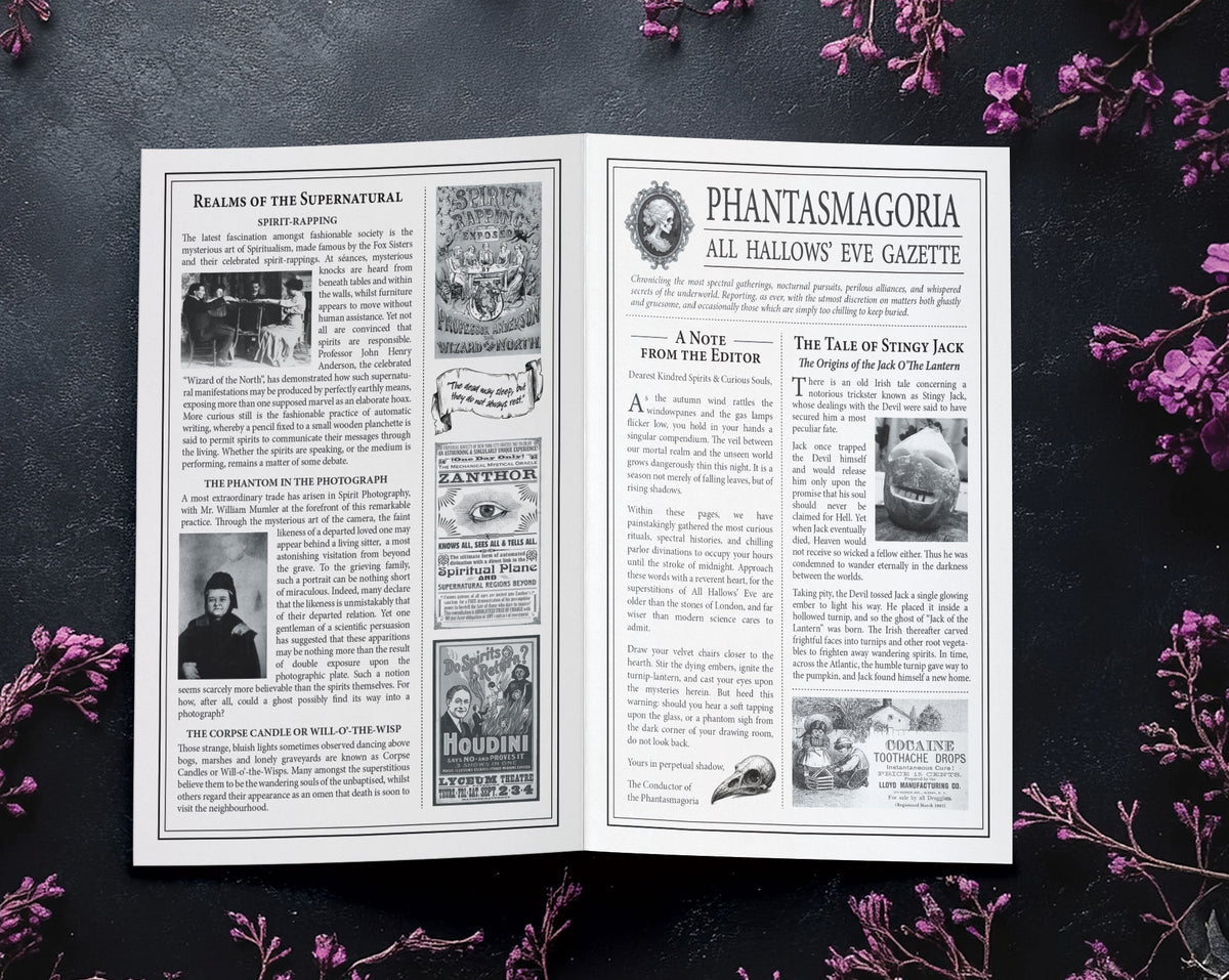 An open vintage-style magazine or book spread titled 'Phantasmagia All Hallows Eve Gazette,' photographed flat on a dark textured surface with purple flowers arranged around it.