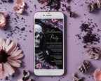 A white smartphone lying on a lavender surface, displaying a gothic Halloween party invitation design with a skull, flowers, and decorative dried petals around it.
