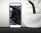 A smartphone mockup displays a Halloween party invitation design with a skull, flowers, and gothic text. The phone is styled on a dark surface next to a white decorative pumpkin against a light draped background.