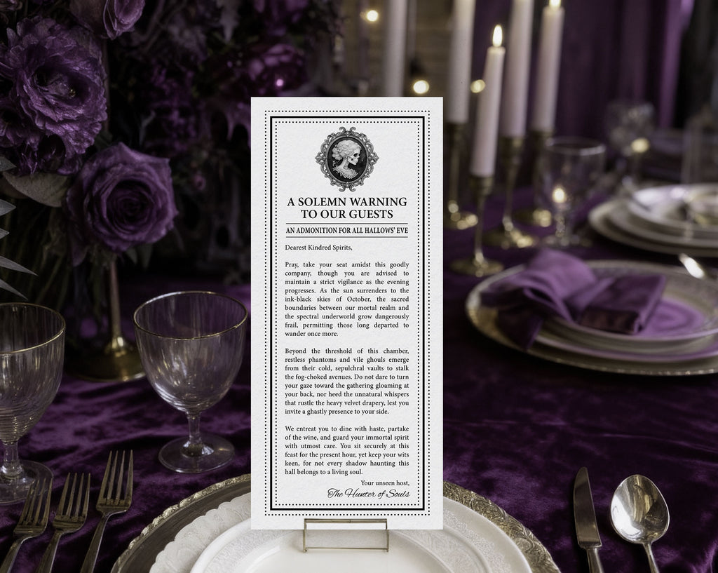 A vertical printed halloween card reading 'A Solemn Warning to Our Guests' is displayed upright on a table setting with purple flowers, plates, candles, and silverware in the background.