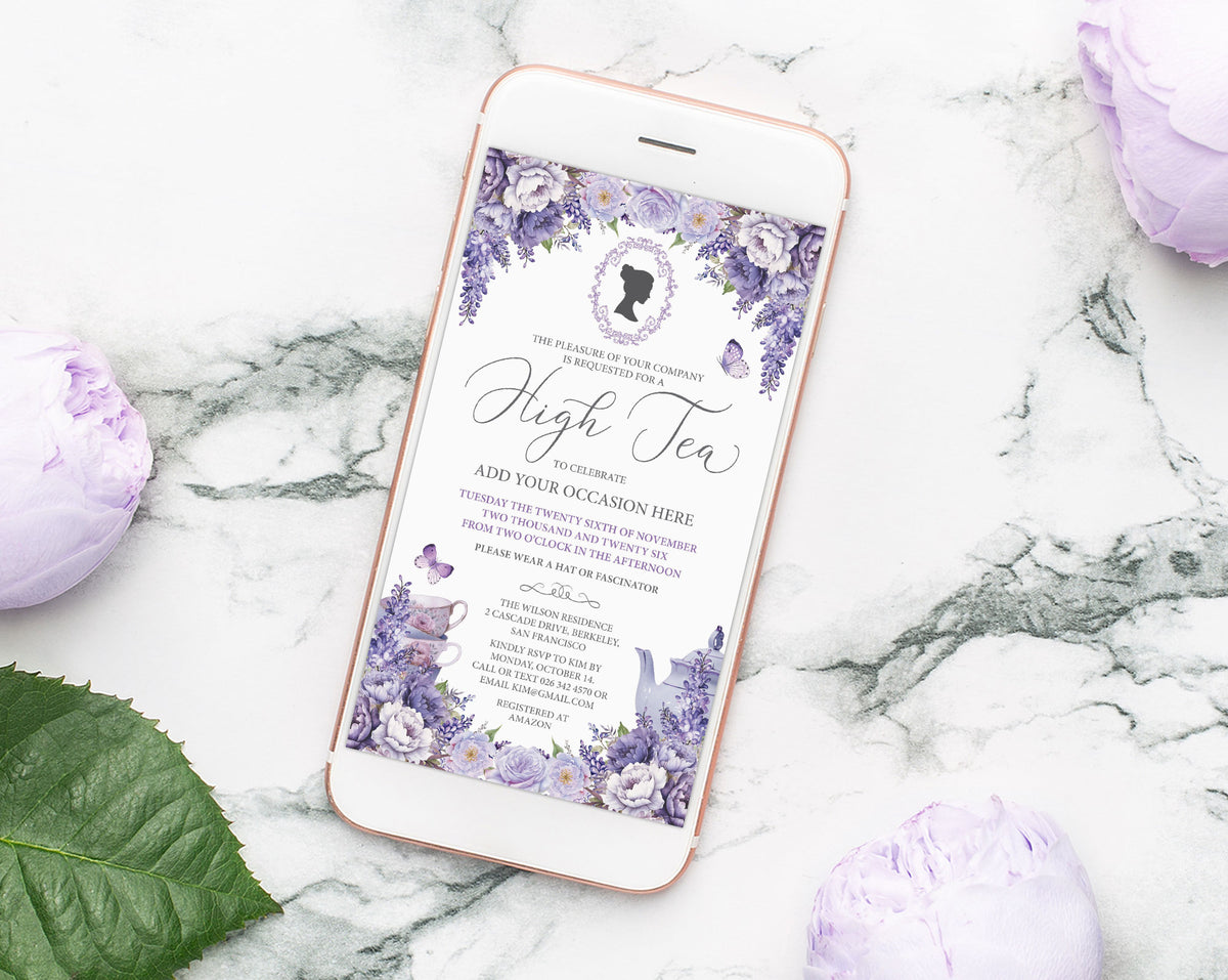 A rose gold smartphone lying on a white marble surface, displaying a lavender regency cameo invitation design for a high tea, with additional purple flowers and a green leaf placed around the phone.