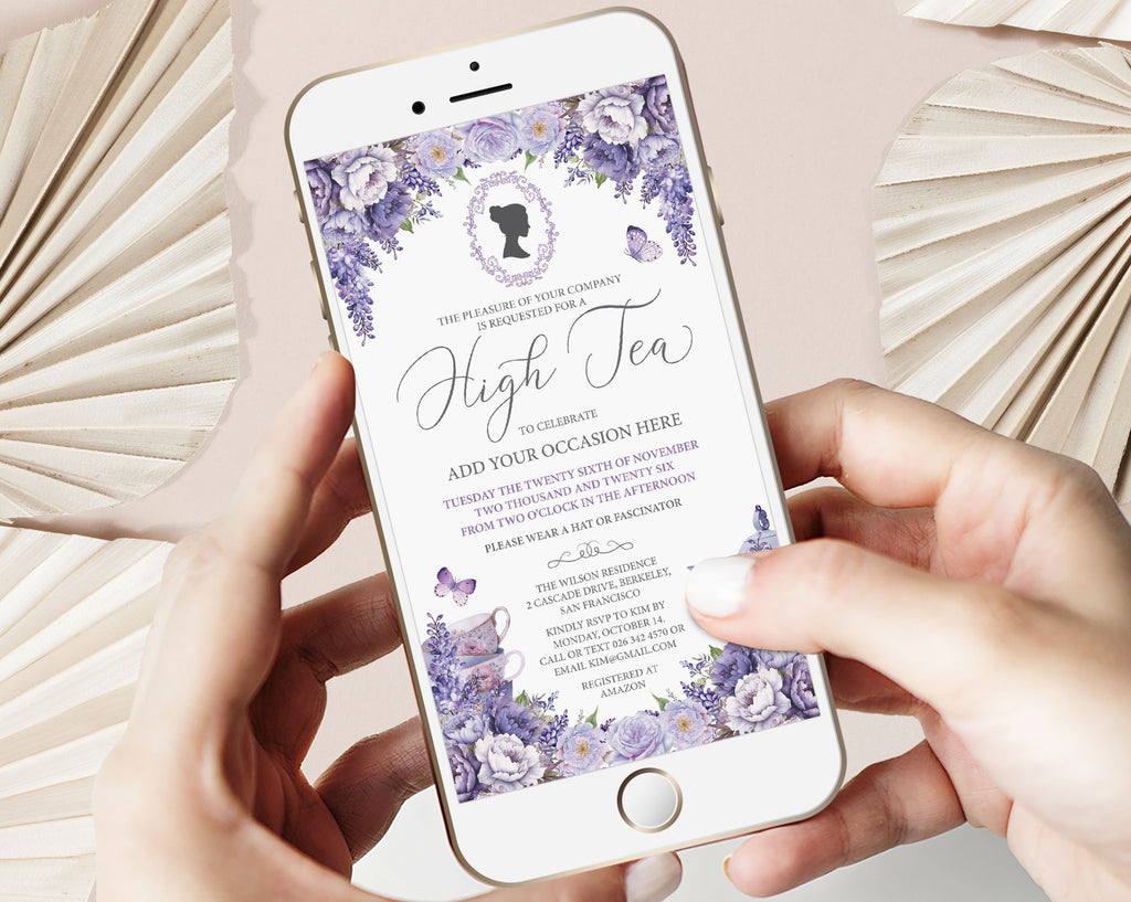 A person holds a white smartphone displaying a purple and lavender high tea invitation design, framed by cream paper fans on a light beige background.