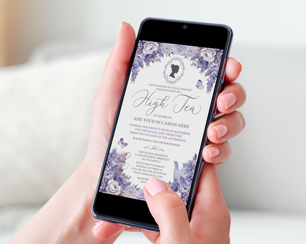 A person holding a smartphone that displays a lavender and white floral invitation card for an high tea event, set against a soft, blurred indoor background.