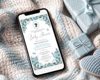 pretty blue regency style baby shower invitation showing on the screen of a mobile phone, laying on a baby blanket next to some blue wrapped gifts