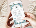 two hands holding a mobile phone with a dusty blue flower regency style bridal shower invitation showing on the screen, beige dried leaves in the background