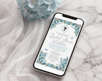A smartphone lying on a white marble surface with sheer white tulle and pale blue flowers. The phone screen displays a bridal shower invitation design with blue floral borders, white background, and elegant text.