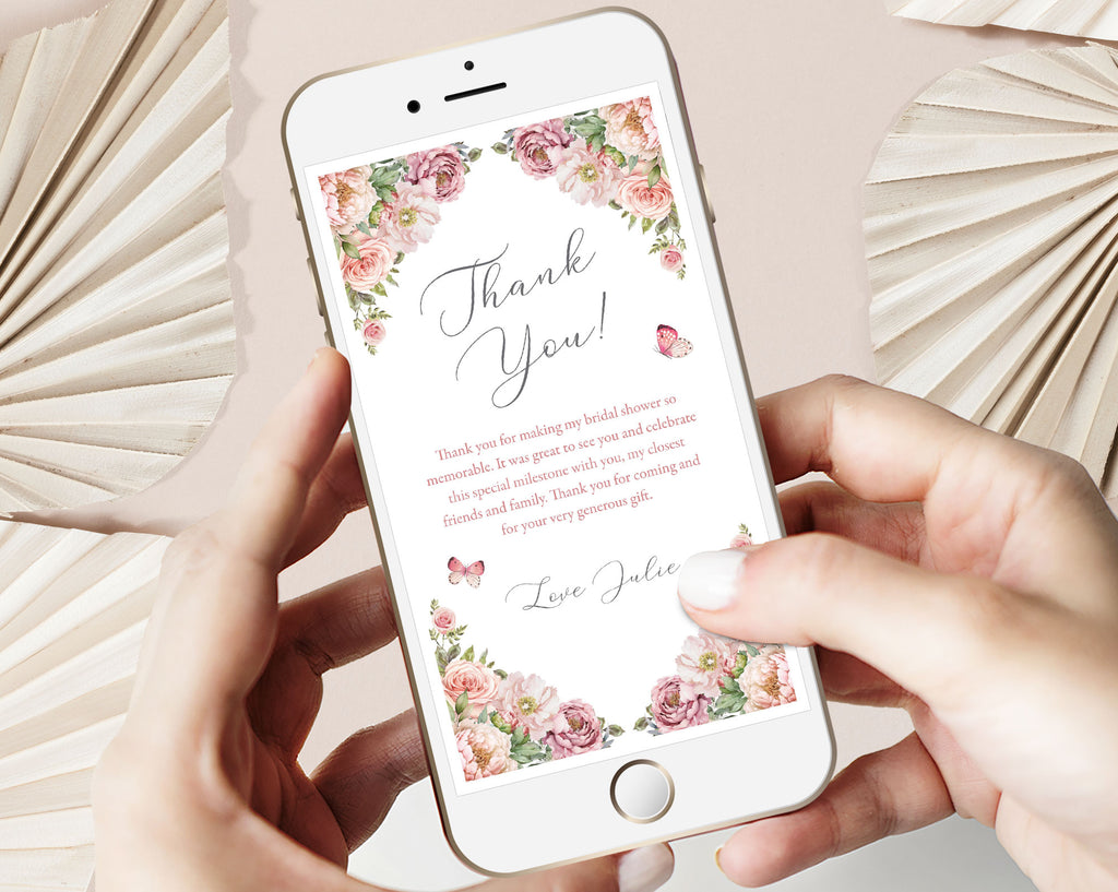 Phone displaying a blush pink floral 'Thank You' card with text on a light background