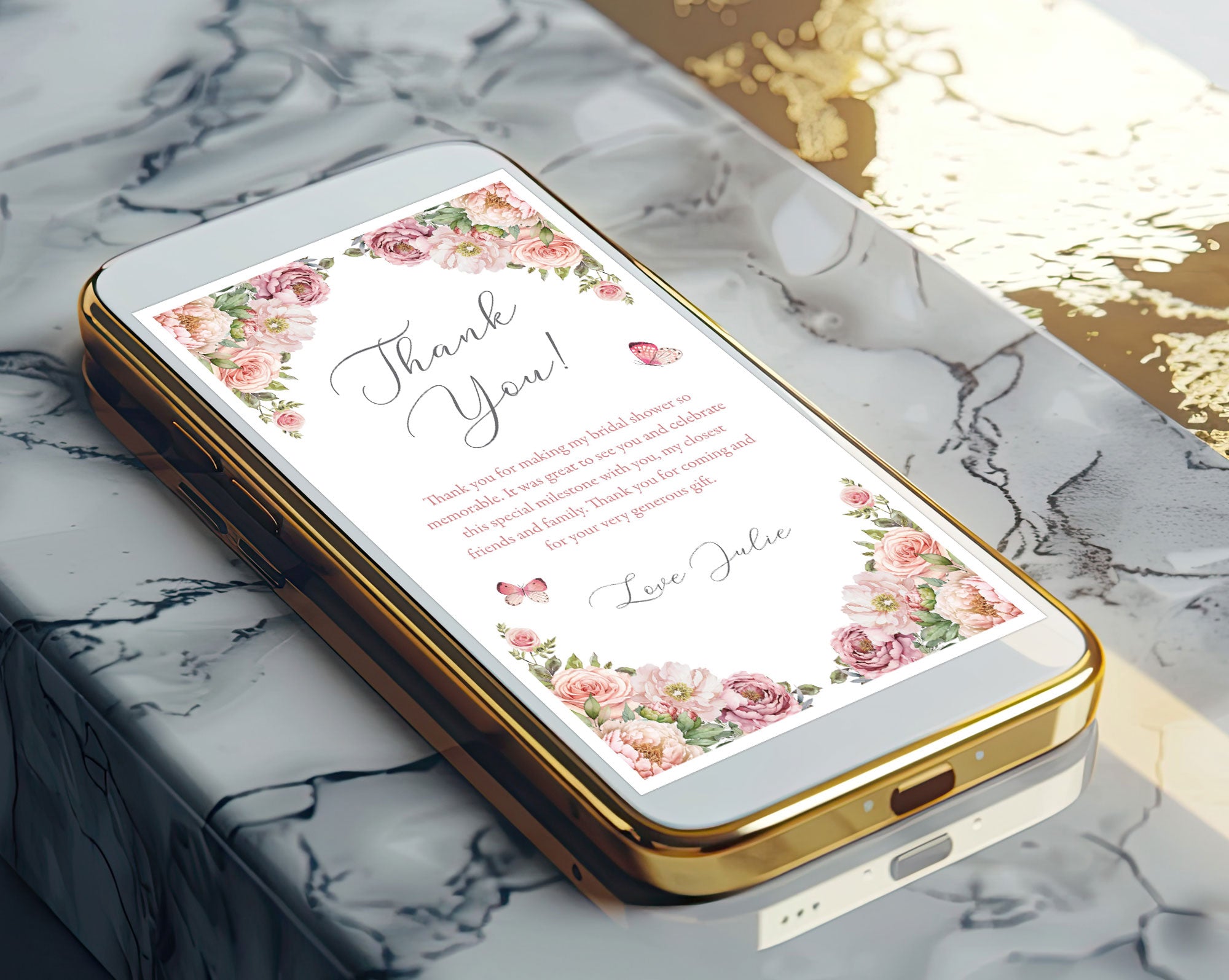 Gold phone case showing a blush pink floral thank you note design on a marble surface