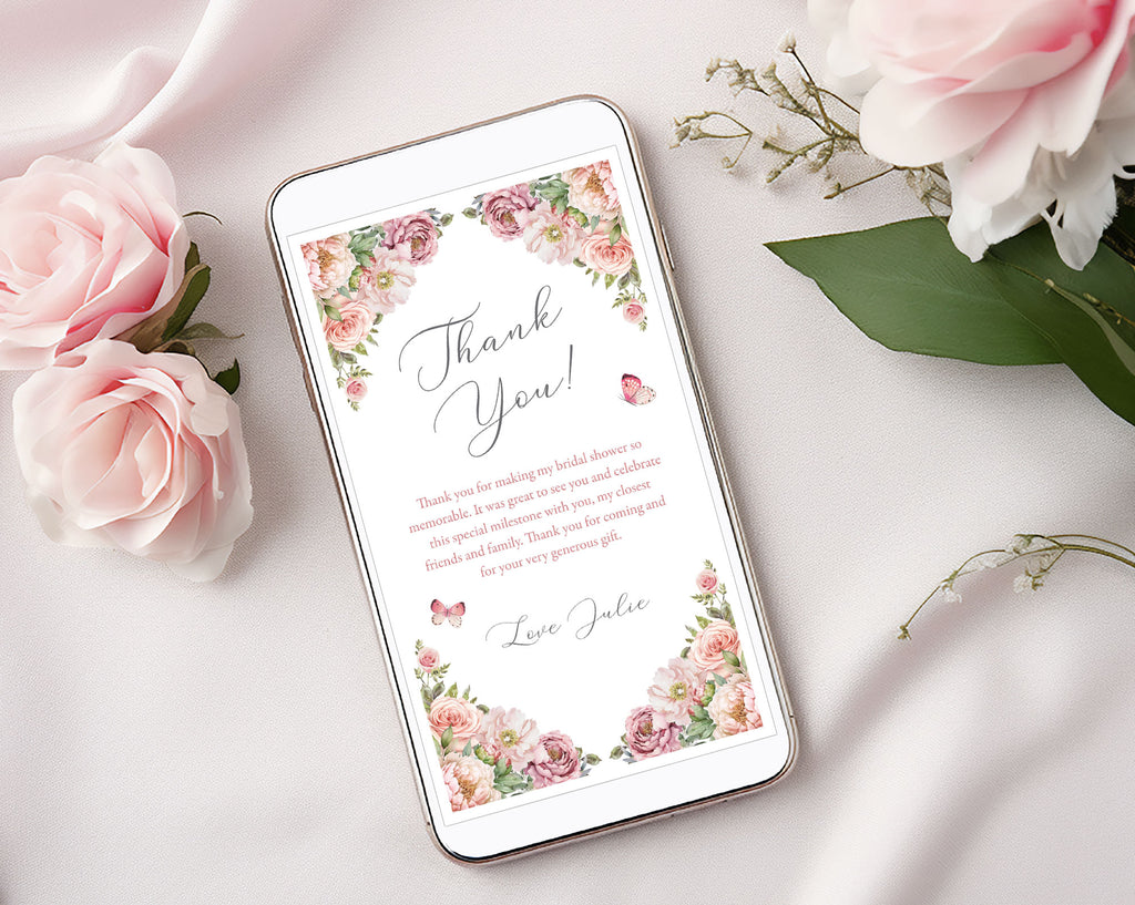 Phone with a thank you note floral design on a light background with blush pink flowers