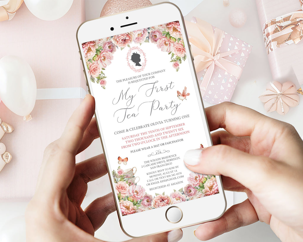 Phone displaying a blush pink regency style 'My First Tea Party' invitation with floral design on a pink background.
