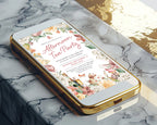 A gold mobile phone showing a Pretty floral afternoon tea invitation laying on a marble surface