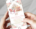 A close-up of a person holding a smartphone that displays a pink princess party invitation with an illustration of a castle, carriage, and floral border.