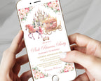 A close-up of a person holding a smartphone that displays a pink princess party invitation with an illustration of a castle, carriage, and floral border.