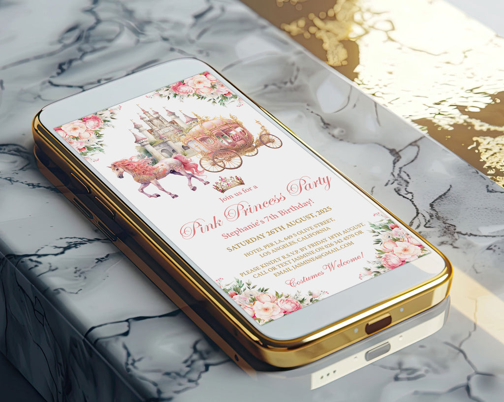 A gold-framed smartphone lying diagonally on a white marble surface, displaying a pink princess party invitation design with floral borders and a carriage illustration.