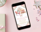 A pink princess party invitation showing on the screen of a black mobile phone with a wand, gift and sequins next to it on a pink background