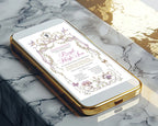 Gold mobile phone with a decorative royal high tea invitation for kids on a marble surface