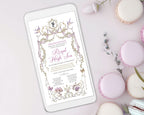 pretty Digital mobile invitation on a phone with macarons on a light background