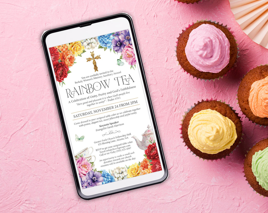 black mobile phone with a church rainbow ladies ministries invitation laying on a pink surface next to some cupcakes with pink, yellow, green and orange icing