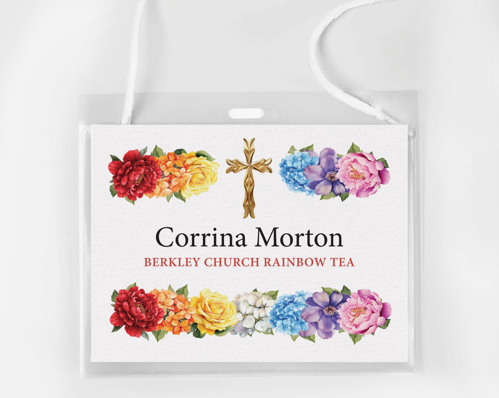 A Church Rainbow Tea Name badge in a plastic holder with neck straps on a white background