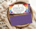 2 pretty religious event admit one tickets for a rainbow tea party, one showing the front and one showing the back, laying on a wooden tray with blossoms