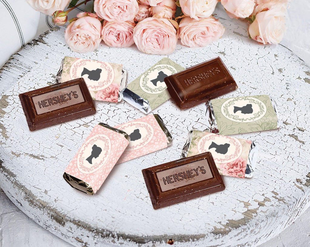 regency style Hershey's chocolate bars on a decorative plate with pink roses.