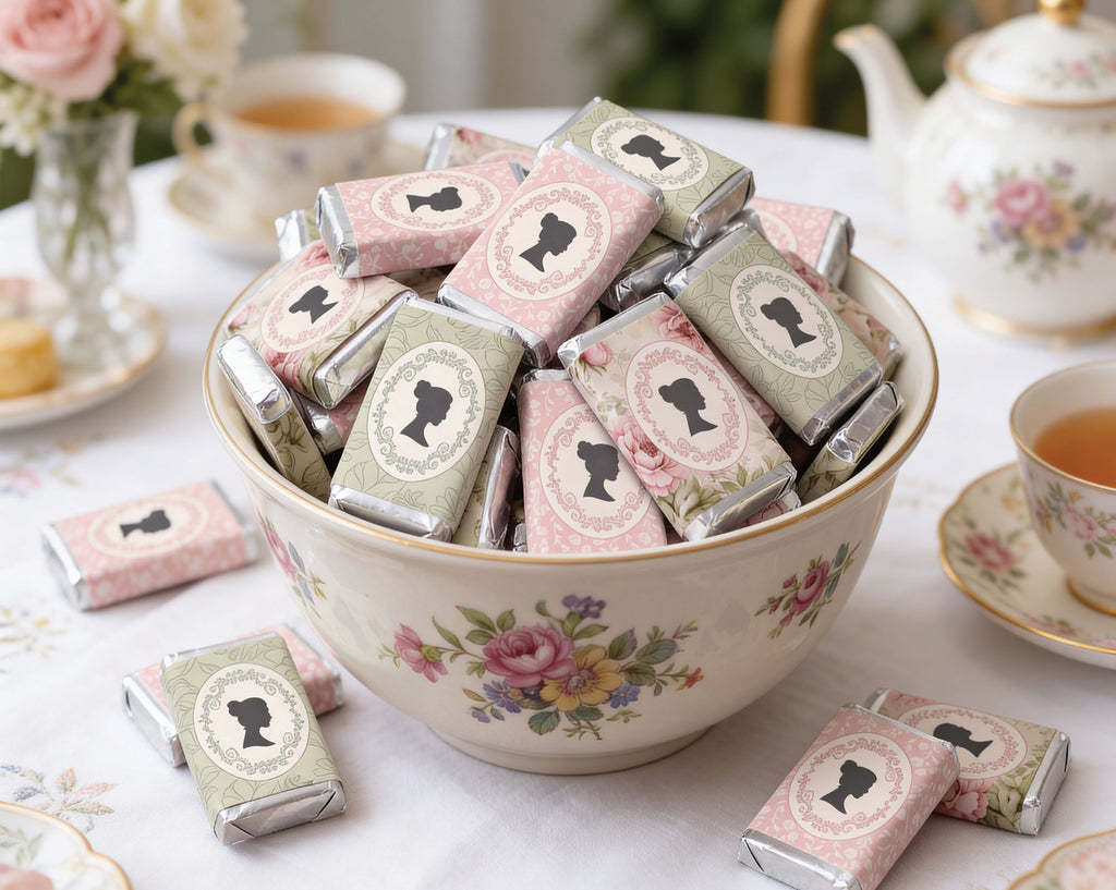 pretty vintage Bowl of chocolate bars with decorative cameo packaging on a table with tea set