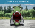 A car trunk shown from the back with a large green dinosaur head graphic printed across it, set in a paved outdoor area with trees. Text at the top reads 'GIANT 36" x 48" DINOSAUR! CREATE A JAW-DROPPING TRUNK OR TREAT DISPLAY!' and 'simulation of setup' appears at the bottom right.