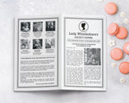 A black and white regency society leaflet with cameo, DIY to send after a party, front side laying on a marble surface next to some peach colored macarons