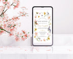a baby shower invitation with floral border with bird graphics showing on a black mobile phone screen next to some pink blossoms